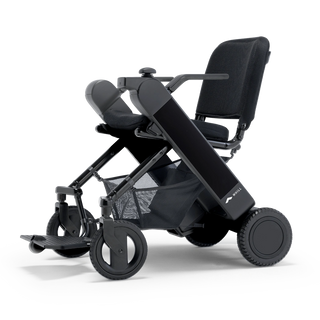 WHILL Model F folding power wheelchair with a black arm cover, three-quarter view