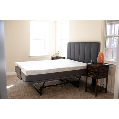 A Flexabed Hi-Low SL adjustable bed with a mattress, shown flat in a bedroom beside a nightstand