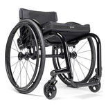 Ki Mobility Rogue 2 in black with a cushion, front three quarter view