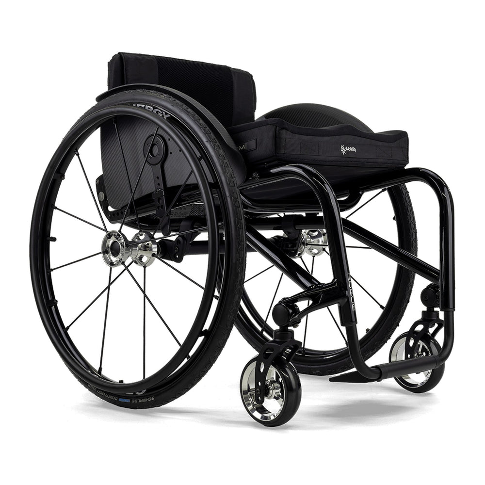 Ki Mobility Rogue DT in black with a cushion, front three quarter view