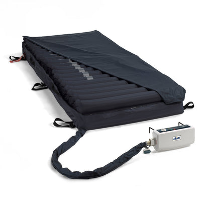 Drive Med-Aire Melody mattress with its control unit, three-quarter view showing the air cells under the cover