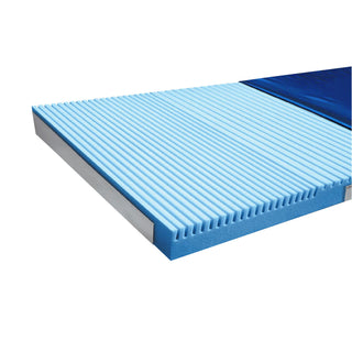 Drive Multi-Ply ShearCare 1500 mattress at three-quarter view with the cover folded back to show the die-cut top foam