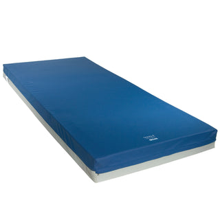 Drive Gravity 8 mattress made up with its blue stretch cover on, three-quarter view