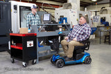 Pride Revo 2.0 4-Wheel mobility scooter outdoors, lifestyle scene