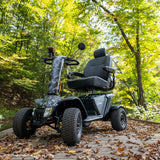 Pride Baja Wrangler 2 off-road mobility scooter outdoors, lifestyle scene