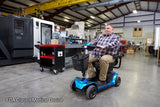 Pride Revo 2.0 4-Wheel mobility scooter outdoors, lifestyle scene