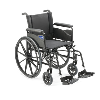 Invacare 9000 XT wheelchair, front three-quarter view with full-length arms and swing-away footrests