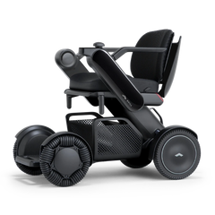 WHILL Model C2 power wheelchair with a black arm cover, three-quarter view