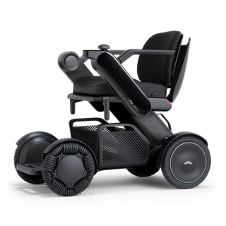 WHILL Model C2 power wheelchair with a black arm cover, three-quarter view
