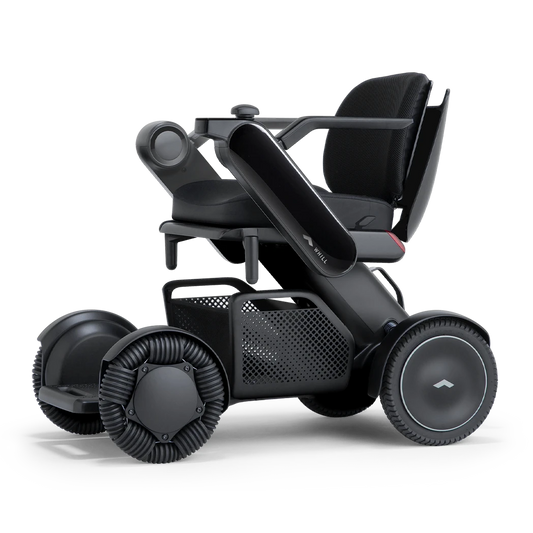 WHILL Model C2 power wheelchair with a black arm cover, three-quarter view
