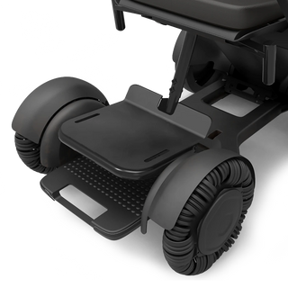 WHILL height adjustable foot support fitted to a Model C2 power wheelchair