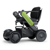 WHILL Model C2 power wheelchair with a green arm cover, three-quarter view