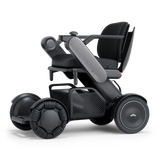 WHILL Model C2 power wheelchair with a gray arm cover, three-quarter view