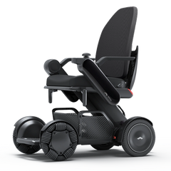 WHILL Model C2 High Back power wheelchair with a black arm cover, three-quarter view