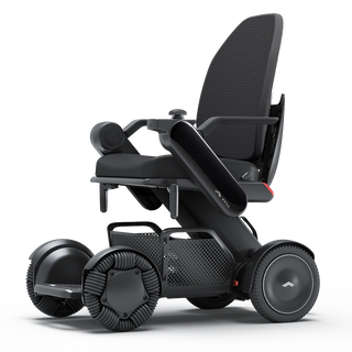 WHILL Model C2 High Back power wheelchair with a black arm cover, three-quarter view