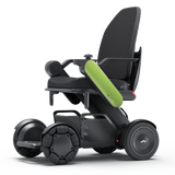 WHILL Model C2 High Back power wheelchair with a green arm cover, three-quarter view