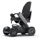 WHILL Model C2 High Back power wheelchair with a gray arm cover, three-quarter view