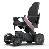 WHILL Model C2 High Back power wheelchair with a pink arm cover, three-quarter view