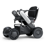 WHILL Model C2 power wheelchair with a white arm cover, three-quarter view