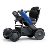 WHILL Model C2 power wheelchair with a blue arm cover, three-quarter view
