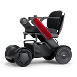 WHILL Model C2 power wheelchair with a red arm cover, three-quarter view