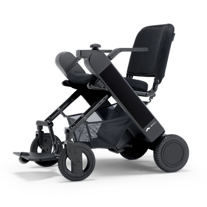 WHILL Model F folding power wheelchair with a black arm cover, three-quarter view