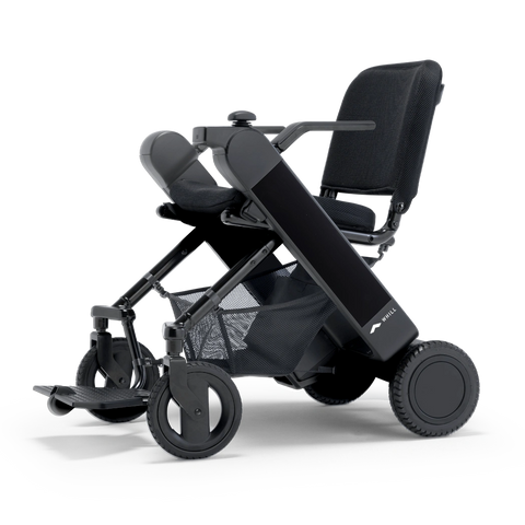WHILL Model F folding power wheelchair with a black arm cover, three-quarter view