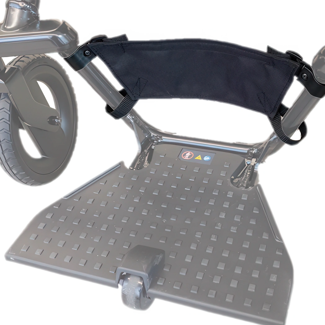 WHILL heel stopper fitted to the footrest of a Model F power wheelchair