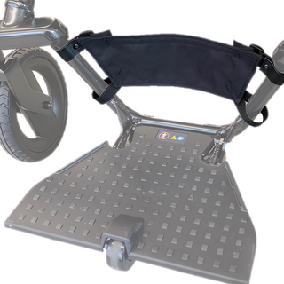 WHILL heel stopper fitted to the footrest of a Model F power wheelchair