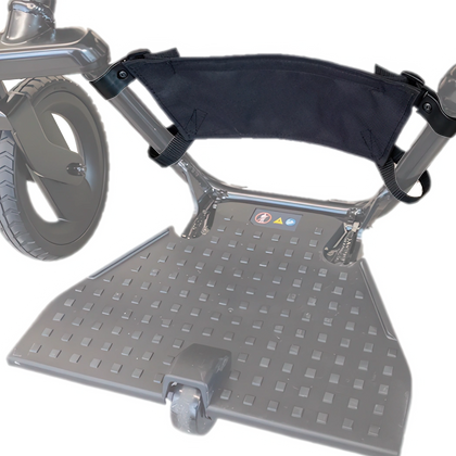 WHILL heel stopper fitted to the footrest of a Model F power wheelchair