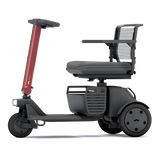 WHILL Model R 3-Wheel mobility scooter with a red tiller cover, side view
