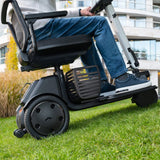 The WHILL Model R 3-Wheel crossing uneven ground