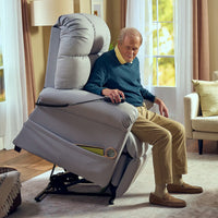 A man standing up from the Perfect Sleep Chair with the lift raised