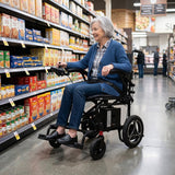 A woman shopping from a Journey Air power chair in a grocery aisle