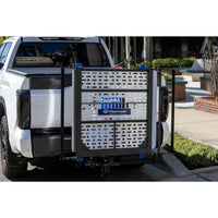 Harmar AL301XL Fusion installed on a vehicle hitch with the platform folded up for driving