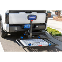 Harmar AL301XLHD Fusion installed on a vehicle hitch with the platform lowered to the ground