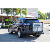 Harmar AL500 fitted to the hitch of an SUV with the platform folded