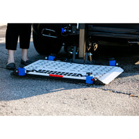 Harmar AL500 platform lowered to the ground behind a vehicle