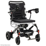 Pride Jazzy Carbon folding power wheelchair in White, three-quarter view