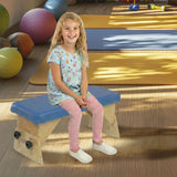 A girl on an Axis bench in a play room