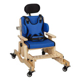 A Pango fitted with the headrest, laterals, trunk harness, footrest, stabilizer and mobility wheels add-ons