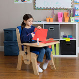 A girl at work in a Pango with the tray add-on in a classroom