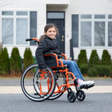 A girl seated in an orange Ziggo outdoors