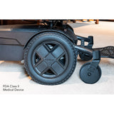 Close-up of the Pride Jazzy EVO 613 13 inch mid-wheel drive wheels