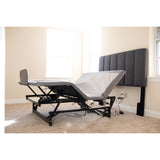 The Flexabed Hi-Low SL base without a mattress, raised with the head lifted, showing the steel frame and an optional covered side rail