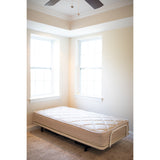 A twin Flexabed Value-Flex shown flat in the corner of a room