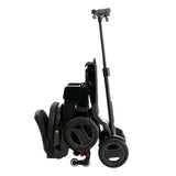 Pride Go Go Carbon mobility scooter folded with the pull handle extended for transport