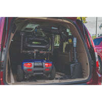 A scooter loaded inside a vehicle by the Harmar AL435 lift