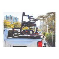 Harmar AL825CC Crew Cab truck lift loading a wheelchair into a pickup bed