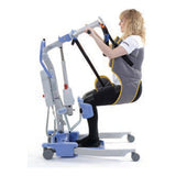 A person lifted in a Hoyer Deluxe Transport Sling